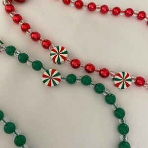 1-set of 2 Festive Beaded cellular lanyards - Red and Green to share